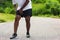 Sport runner black man wear watch hands joint hold leg she has thigh pain while running