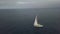 Sport sail yacht floating in blue sea water on cloudy skyline aerial landscape