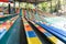 The sport seat grandstand in an empty stadium. Seats at the stadium. Rows of empty plastic seats on the grandstand of a stadium or