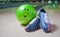 Sport Shoes and green ball on floor in bowling club.
