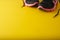 Sport shoes sneackers, gym wear, over yellow background with copy space