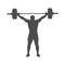 Sport. The silhouette of a weightlifter athlete. The weightlifter raised the bar above his head on outstretched arms