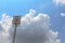 Sport stadium floodlights on a cloudy background.