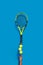 Sport. Tennis racket and balls balancing on a finger