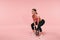 Sport Training. Athletic Woman Doing Squats With Dumbbell