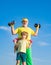 Sport and training concepts. Family sport. Grandfather and son doing exercises. Child raising a dumbbell. Funny old