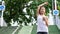 Sport woman stretching running in street park city urban background