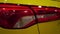 Sport yellow car rear light. Automobile tuning. Luxury coupe.