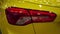 Sport yellow car rear light. Automobile tuning. Luxury coupe.