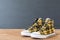 Sport yellow sneakers on old wooden desk