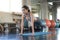 Sport. Young asian athletic woman doing push-up muscular exercising in fitness gym