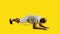 Sportive african man doing plank exercise on the floor