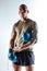 Sportive bold man wearing blue boxing gloves