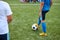 Sportive child boy kicking ball, penalty