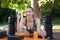 Sportive female arm wrestling outdoor gym summer park