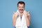 Sportive man with funny mustache thumbing up approving his gym or training