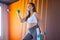 Sportive pregnant girl lifting dumbbells training in a gym, healthy pregnancy concept