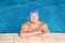 Sportive senior man in indoor pool