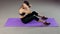 Sportive woman doing abs exercises to have flat belly, training in fitness club