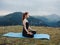 sportive woman doing yoga meditation mountains nature fresh air