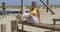 Sportive woman exercising on beach in gym