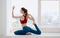 sportive woman near window meditation lifestyle fitness