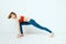 Sportive woman pose gymnastics balance exercise light background