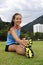 Sportive woman stretching in the park