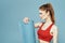 Sportive woman training mat in hands Red tank top exercise blue background