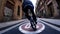 Sportive young man bmx rider moves along empty narrow bycycle track in street.