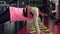 sportive young woman is engaged in the gym and does the plank exercise
