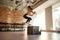 Sportive young woman jumping using plyo box while having workout at industrial gym