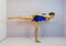 Sports acrobatic gymnastics arabesque straight plank balance with pointed feet preformed by a transgender girl