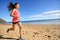 Sports athlete runner running woman on beach