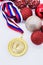 Sports award and Christmas toys, medal and red Christmas balls, winter competitions, new year`s holiday