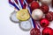 Sports award and Christmas toys, medal and red Christmas balls, winter competitions, new year`s holiday