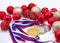 Sports award and Christmas toys, medal and red Christmas balls, winter competitions, new year`s holiday