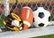 Sports balls. Soccer ball, american football and baseball in glove. Outdoors