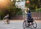 Sports, basketball and men in wheelchair for goal in training, exercise and workout on outdoor court. Fitness, team and