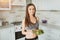 Sports beautiful young girl does salad after a hard workout fitness