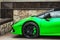 Sports car green color clearance detail brakes low suspension