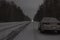 Sports car at night on a winter icy road in the absence of traffic