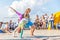 sports children show acrobatic stunts on the Volga embankment on a sports holiday on a sunny day