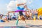 sports children show acrobatic stunts on the Volga embankment on a sports holiday on a sunny day