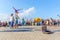 Sports children show acrobatic stunts on the Volga embankment on a sports holiday on a sunny day