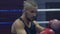 Sports club, portrait of beautiful boxer man in red gloves in the ring with an opponent during training close up