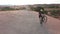 Sports, dirt and people cycling in desert on an adventure trail training for race or competition. Fitness, bicycle and