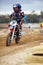 Sports, dirt road and athlete riding a motorcycle with speed for a race or sport competition. Challenge, fitness and man