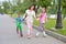 Sports education-mother with children on roller skates in the Pa