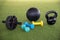 Sports equipment  on the floor, with ab wheel , dumbbells, kettlebells and ball